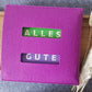 Schokohülle Ausschnitt "Alles Gute"